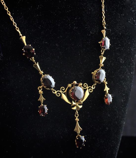 A Victorian style 18k gold and garnet drop pendant necklace, 16.5in inc. drop.